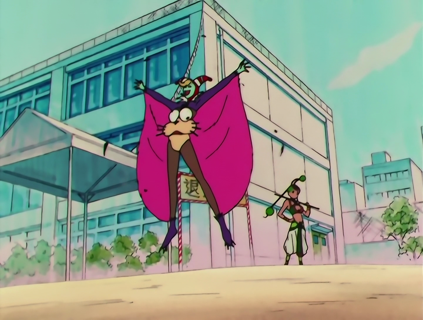 Tobikiri Yarou, a Lemures from Sailor Moon episode 155. Here goes. He has turquoise skin and blonde hair, a small amount of which is visible beneath his red and white jester’s hat. He’s wearing a kind of wingsuit with purple sleeves and brown pants, and large pink wings running from his wrists to his legs. The body of his costume looks like a giant cartoonish flying squirrel head, with eyes pointing in different directions. He’s hovering a few feet above the ground.